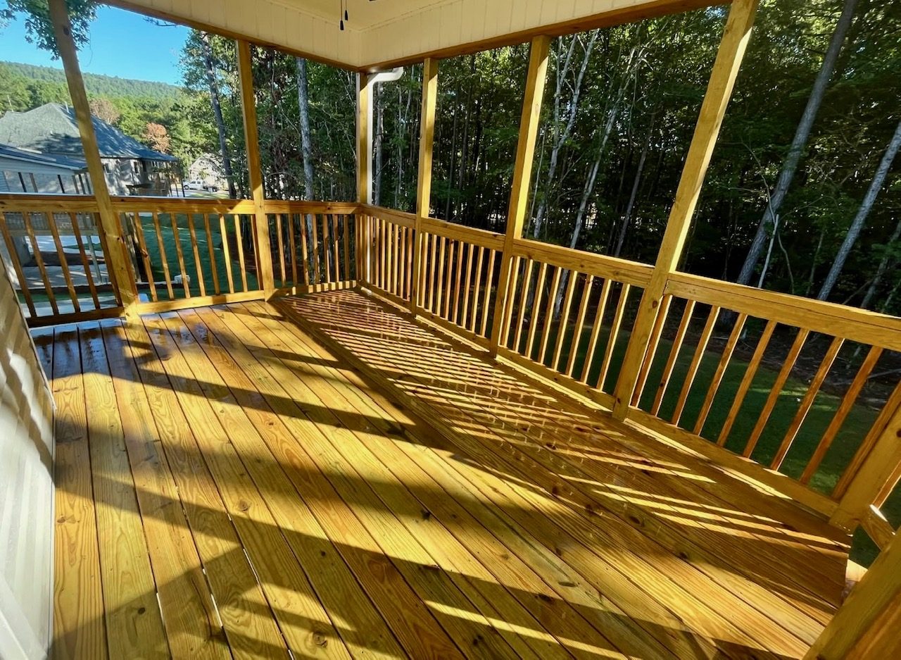 Covered wood deck overlooking the trees